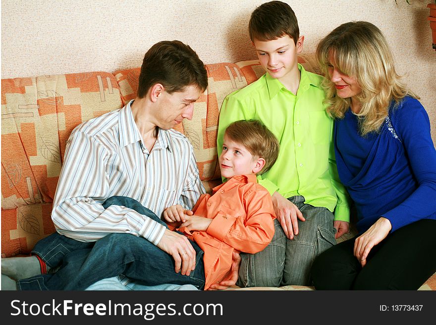 An image of a happy family indoors