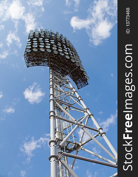 Stadium light tower against a blue sky