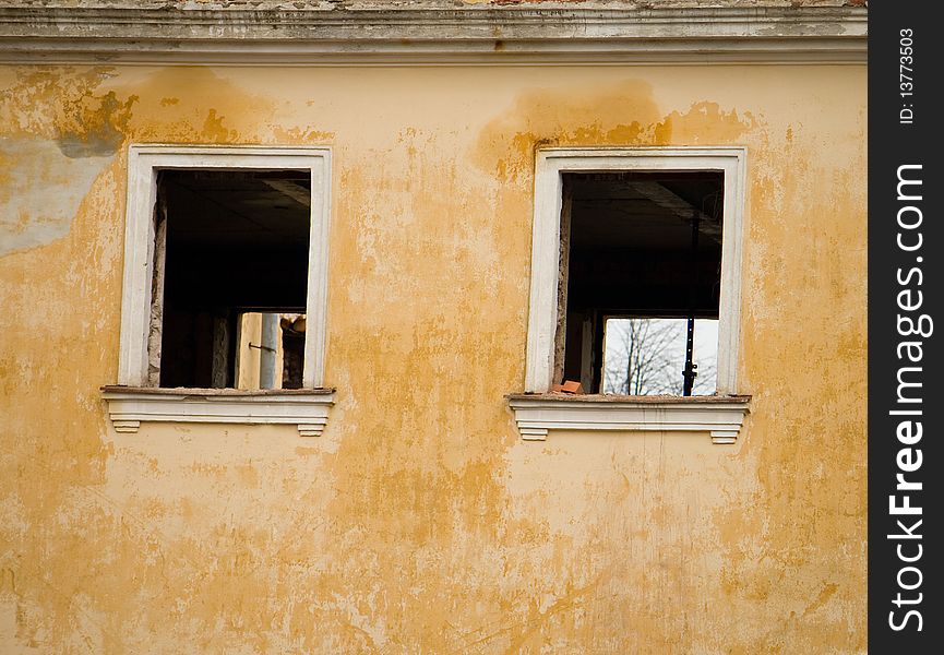 The wall of old building with windows