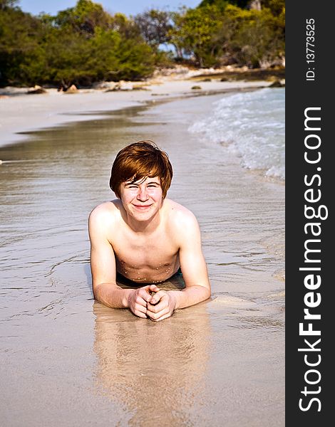 Happy Boy With Red Hair Is Enjoying The Beach