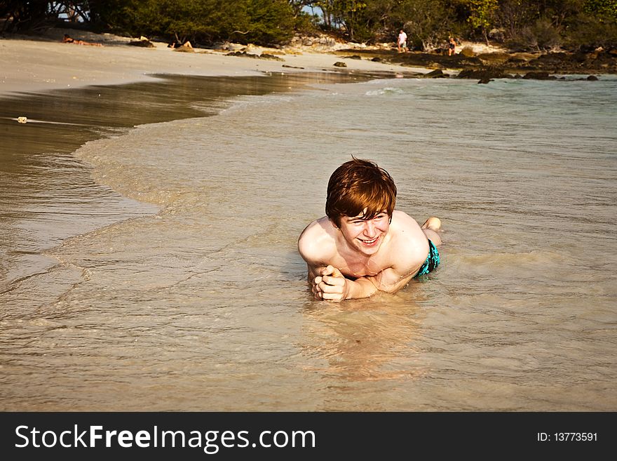 Happy boy with red hair is enjoying the beautiful beach. Happy boy with red hair is enjoying the beautiful beach