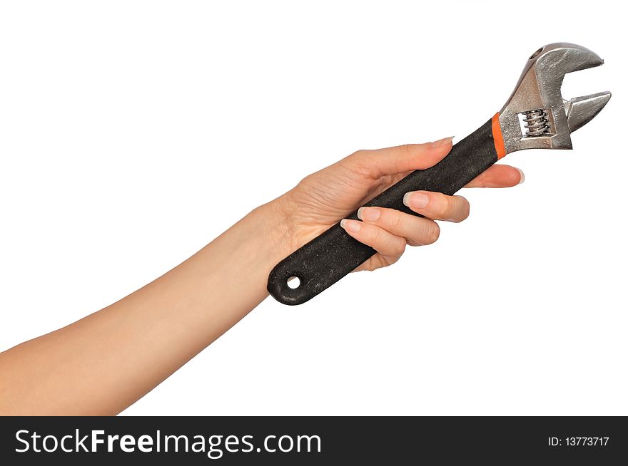 Woman holding a adjustable spanner in the hand