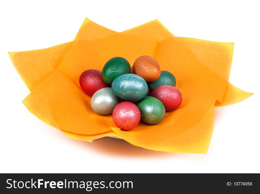 Easter dyed egg for orange napkin on white background