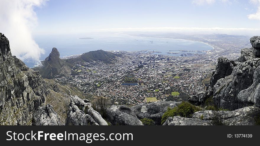 A panoramic view of Lions Head, Signal Hill and the city bowl of Cape Town, South Africa, as seen from the top of Table Mountain. A panoramic view of Lions Head, Signal Hill and the city bowl of Cape Town, South Africa, as seen from the top of Table Mountain