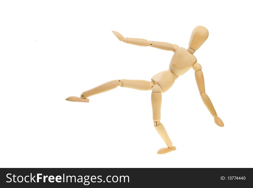 Artist's mannequin in a martial art kicking pose. Artist's mannequin in a martial art kicking pose