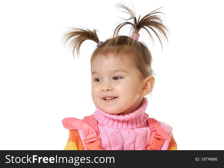 The little girl smiles on a white background