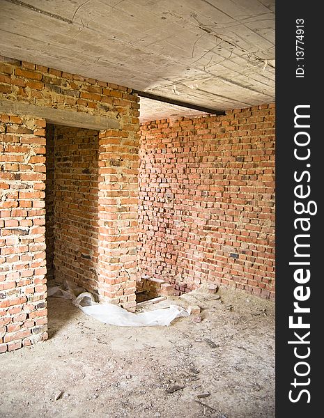 Unfinished clay brick home building construction. Unfinished clay brick home building construction