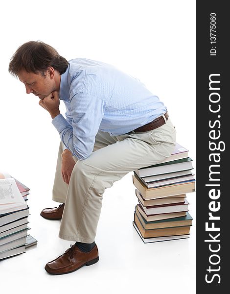 The young student with books isolated on a white