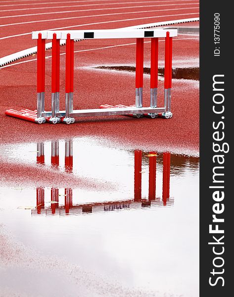 Hurdles near the runway on a wet, rainy day