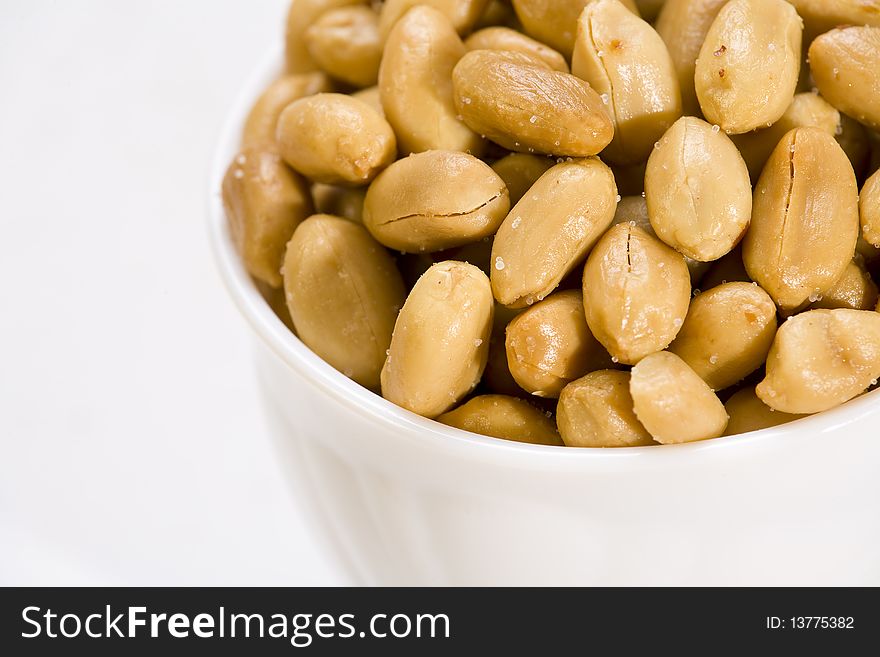 Peanuts in white bowl. Close-up. Shallow dof. Eos 1ds mkII