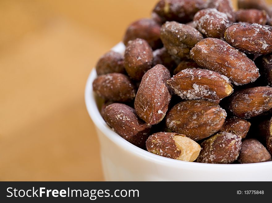 Peanuts in white bowl. Close-up. Shallow dof. Eos 1ds mkII