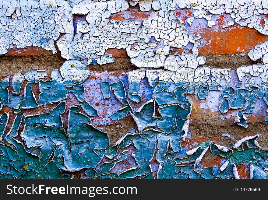 Texture - old dirty wall covered with peeling paint