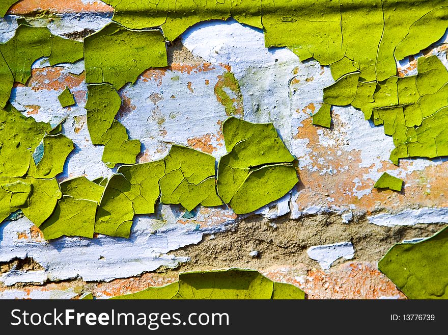 Texture - old dirty wall covered with peeling paint