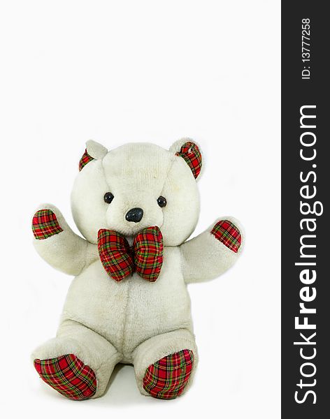 Teddy bear toy sitting on a white background