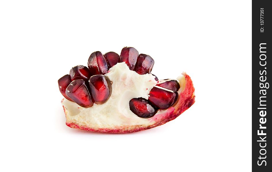 Macro of pomegranate berries isolated on the white background