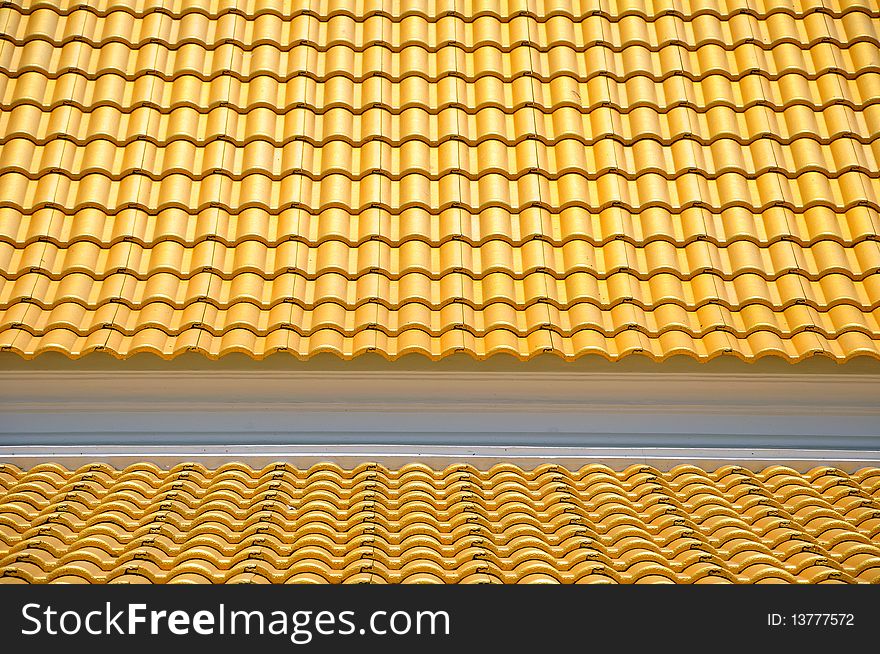 Golden tiles roof of thai temple. Golden tiles roof of thai temple.