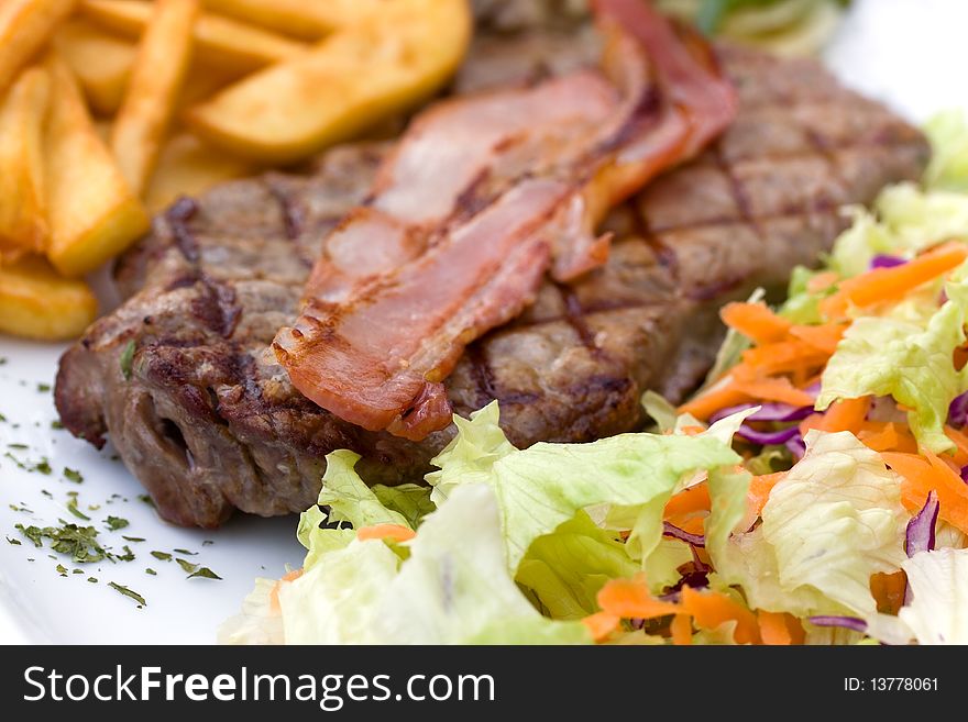 Fresh Sirloin steak with bacon,chips ,mushrooms,salad