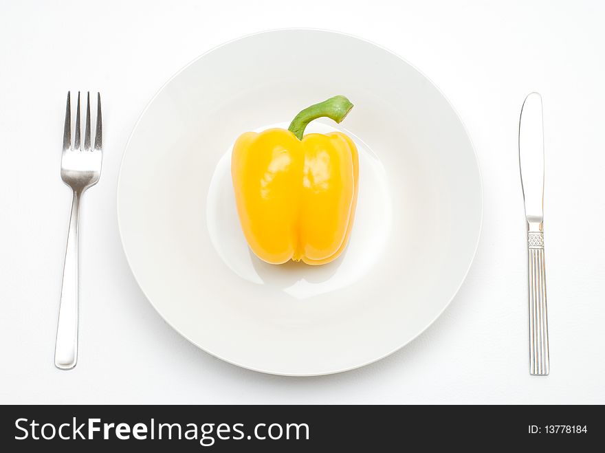 Paprika on the plate with a fork and knife