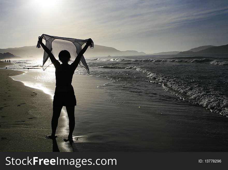 A woman silhouette, backlighting photography,at the beach of Yalong Bay in Sanya city of Hainan province in CHina