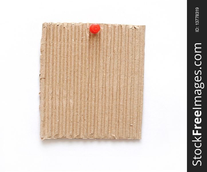 Cardboard on pin isolated on white background