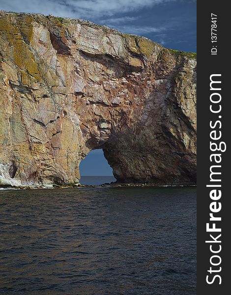 In Gaspesie, in the province of Quebec, Canada, close-up of The Rocher Percé. In Gaspesie, in the province of Quebec, Canada, close-up of The Rocher Percé