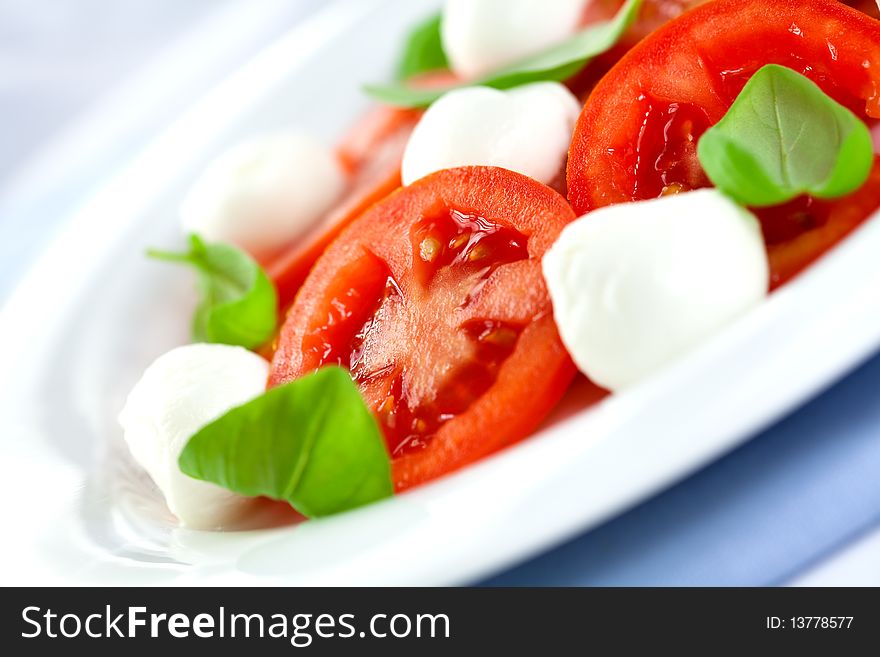 Close up of salad with mozzarella and tomatoes. Close up of salad with mozzarella and tomatoes