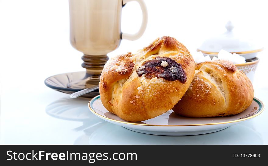 Two pies with tea and sugar. Two pies with tea and sugar