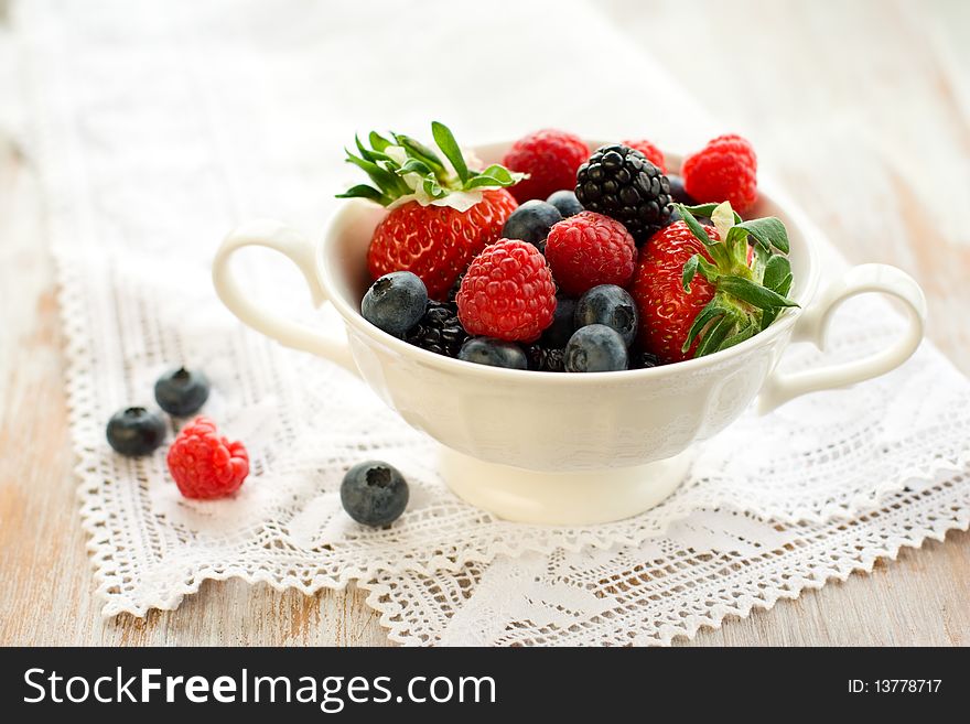 Mixed berries in a bowl : strawberries, raspberries, blueberries and blackberries. Mixed berries in a bowl : strawberries, raspberries, blueberries and blackberries.