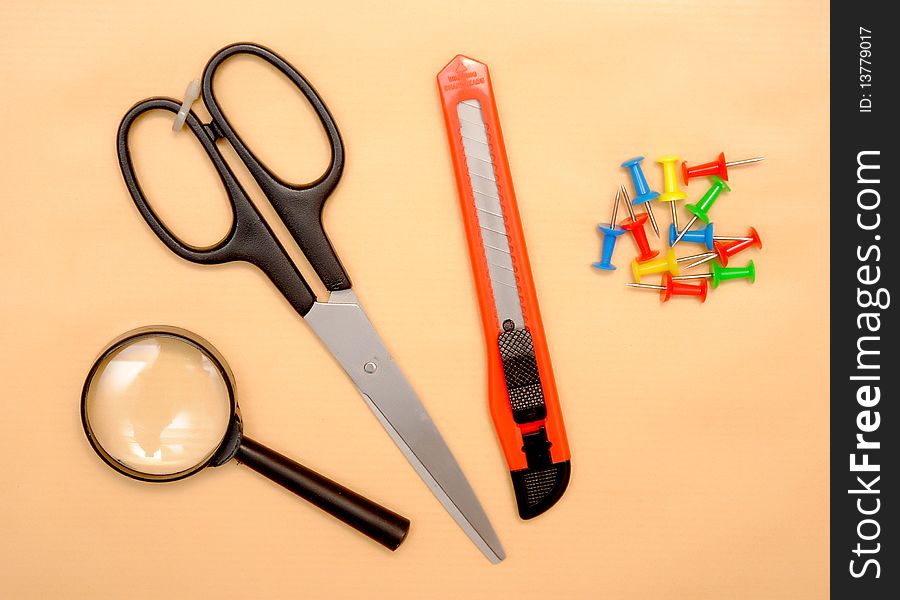 Office objects over brown paper background