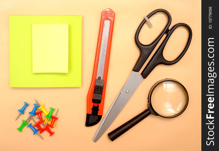 Office objects over brown paper background