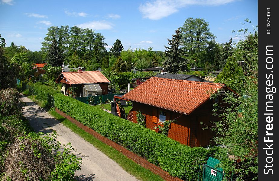 Allot garden with summerhouses in the nature in summer