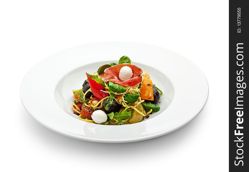 Spaghetti with Vegetables, Ham, Black Olives, Rucola and Pesto Sauce