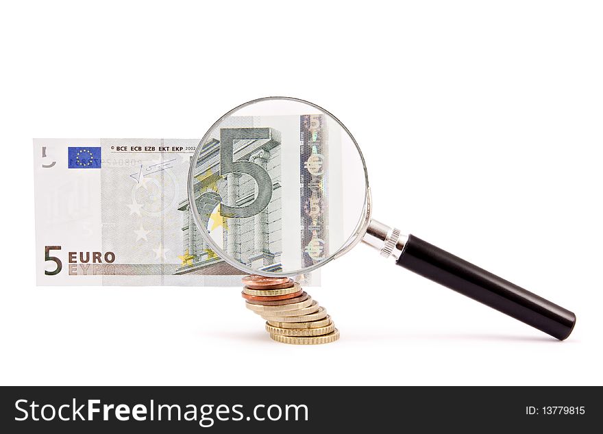 A magnifying glass over a 5 euro note. A magnifying glass over a 5 euro note.