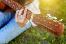 Woman Hands Playing Acoustic Guitar Stock Photo
