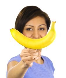 Young Woman Holds A Banana Stock Photography