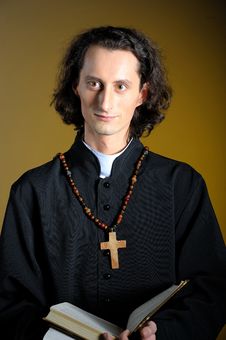 Praying Priest With Wooden Cross And Bible Stock Photography Praying Priest With Wooden Cross And Bible Stock Photography