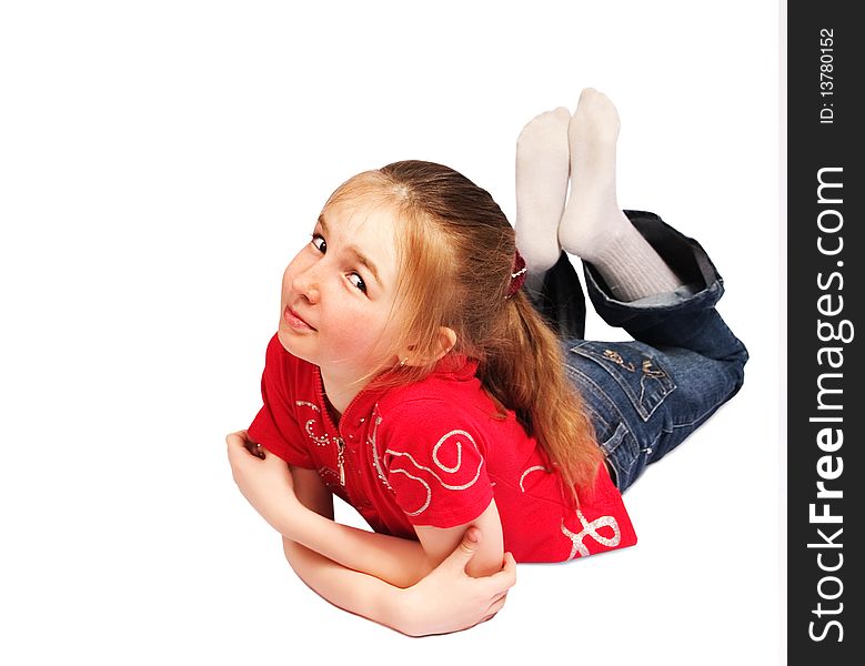 Little girl lies on floor isolated over white