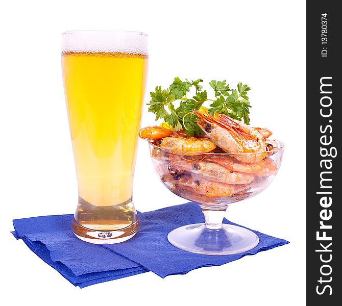 Beer in glass and dish with shrimps on white background. Beer in glass and dish with shrimps on white background