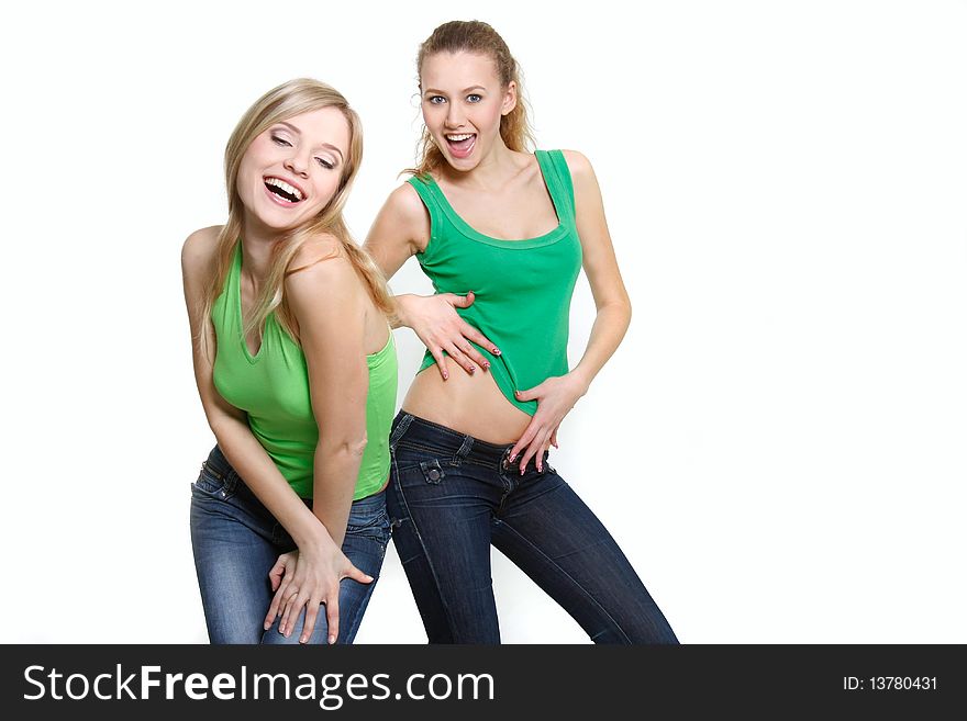 Two happy dancing girls over white