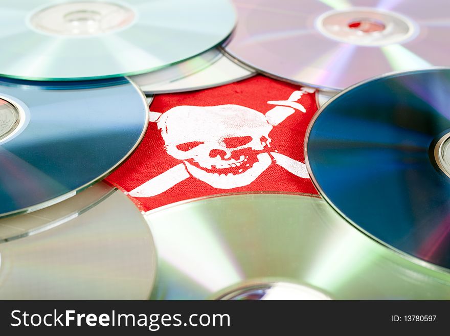 Dvd disks with pirate skull, concept