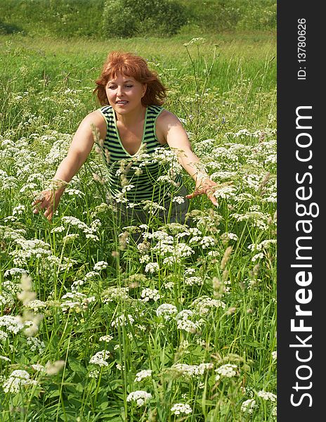 Beauty middle aged woman on meadow. Beauty middle aged woman on meadow