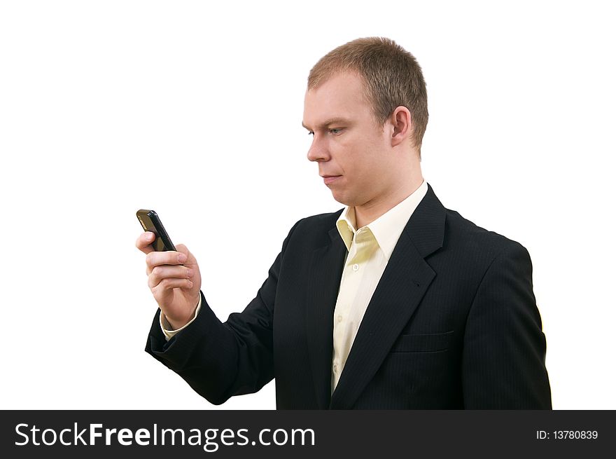 Young businessman in suit keeping cellphone, isolated on white