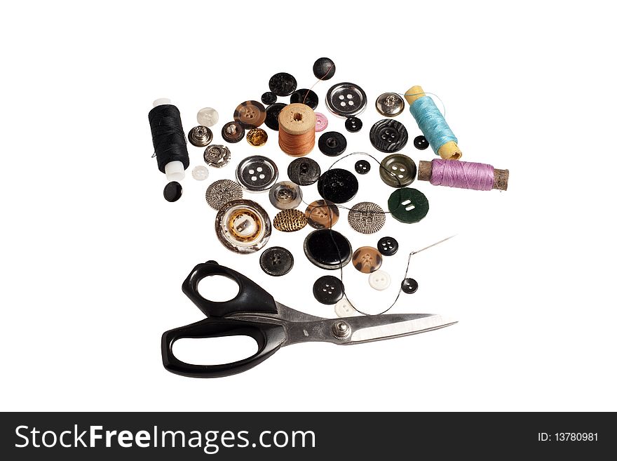 Scissors,  lot of buttons and threads