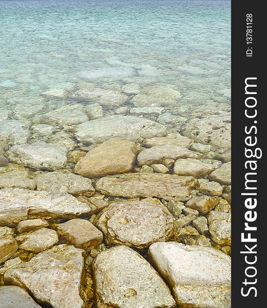 Clear Waters With Rocky Bottom Background