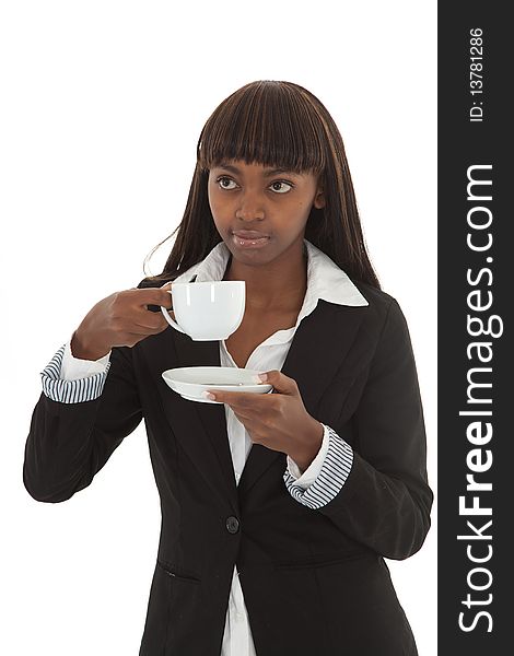 Young black female executive drinking coffee out of a cup. Young black female executive drinking coffee out of a cup