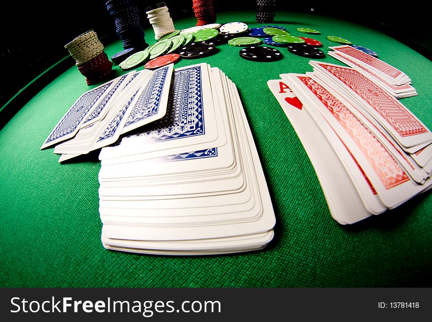Casino gambling chips on green table. Casino gambling chips on green table