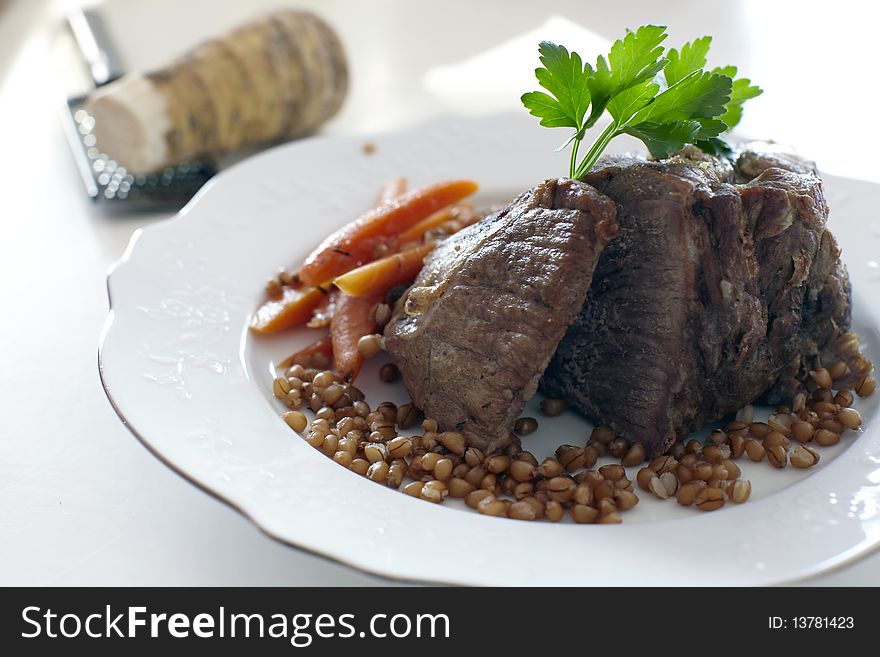 Roast meat with wheat grains, carrots and horseradish. Roast meat with wheat grains, carrots and horseradish.