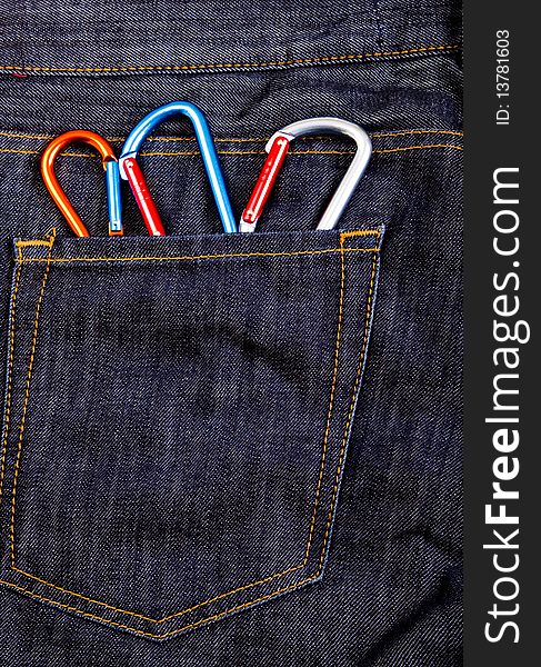 Climbing equipment in jeans pocket. Climbing equipment in jeans pocket