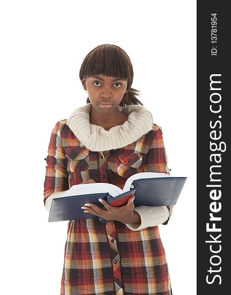 Young female black student looking up from handbook isolated on white