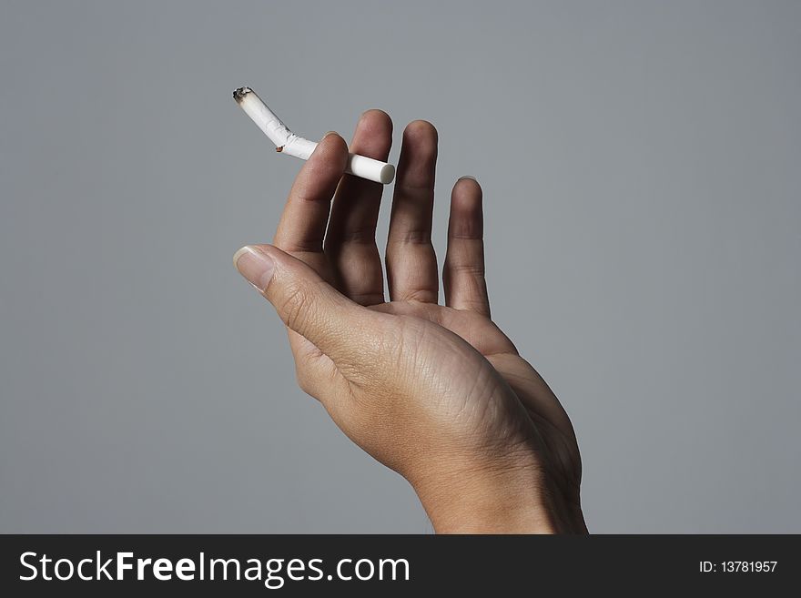 Man hand with breaking a cigarette. Man hand with breaking a cigarette